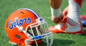 A Florida Gators player ties his shoe before the Buffalo Wild Wings Citrus Bowl- Florida Gators football- 1280x852