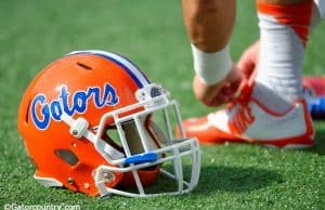 A Florida Gators player ties his shoe before the Buffalo Wild Wings Citrus Bowl- Florida Gators football- 1280x852