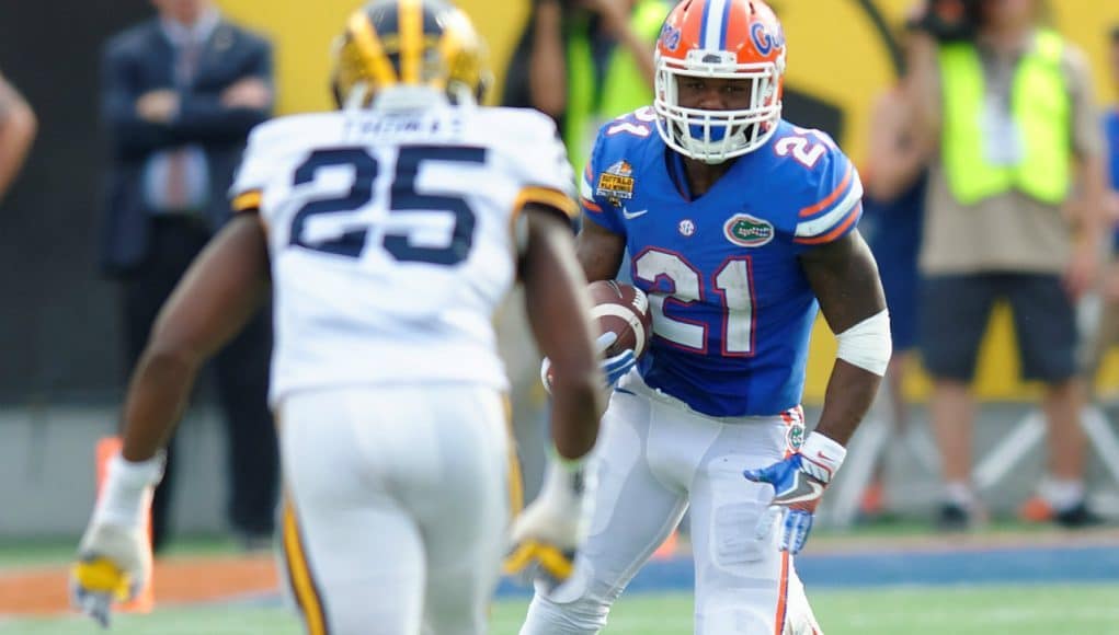 Florida Gators junior running back Kelvin Taylor carries the ball against the Michigan Wolverines in the 2016 Citrus Bowl- Florida Gators football- 1280x852