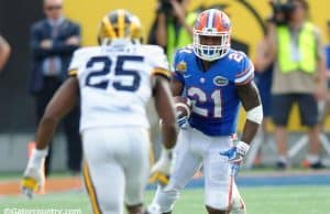 Florida Gators junior running back Kelvin Taylor carries the ball against the Michigan Wolverines in the 2016 Citrus Bowl- Florida Gators football- 1280x852