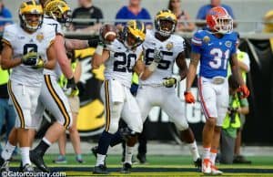 Michigan running back Drake Johnson celebrates a touchdown in Michigan's 41-7 win over the Florida Gators- Florida Gators football- 1280x852