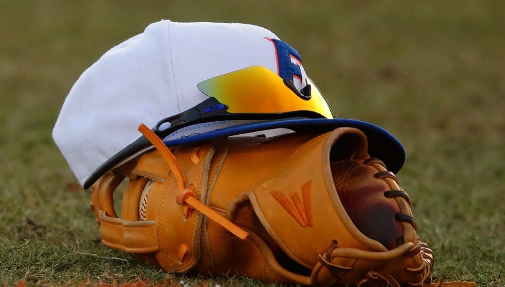 A Florida Gators baseball hat and glove in a win against Florida Gulf Coast University to start the season 2-0. February 20th, 2015- Florida Gators baseball- 1280x852