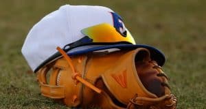 A Florida Gators baseball hat and glove in a win against Florida Gulf Coast University to start the season 2-0. February 20th, 2015- Florida Gators baseball- 1280x852