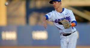 Florida Gators infielder Dalton Guthrie throws the ball home before the Florida Gators game against the Florida State Seminoles- Florida Gators baseball- 1280x852