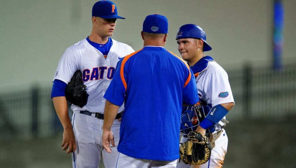 Kevin O'Sullivan meets with catcher Mike Rivera and starting pitcher Logan Shore during a win over Auburn- Florida Gators baseball- 1280x854