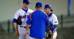 Kevin O'Sullivan meets with catcher Mike Rivera and starting pitcher Logan Shore during a win over Auburn- Florida Gators baseball- 1280x854