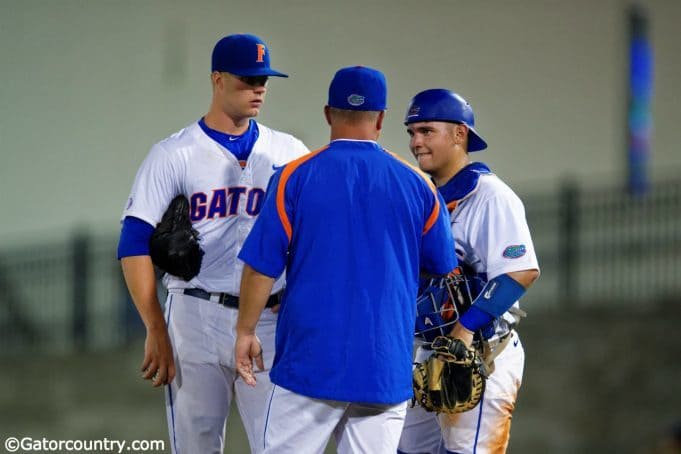 Kevin O'Sullivan meets with catcher Mike Rivera and starting pitcher Logan Shore during a win over Auburn- Florida Gators baseball- 1280x854