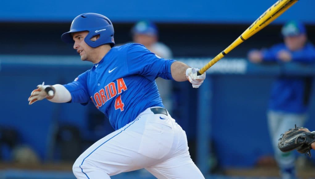 Florida Gators catcher Mike Rivera swings away at a pitch in a win against Florida Gulf Coast University to start the season 2-0 - Florida Gators baseball- 1280x852