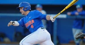 Florida Gators catcher Mike Rivera swings away at a pitch in a win against Florida Gulf Coast University to start the season 2-0 - Florida Gators baseball- 1280x852