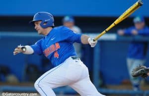 Florida Gators catcher Mike Rivera swings away at a pitch in a win against Florida Gulf Coast University to start the season 2-0 - Florida Gators baseball- 1280x852