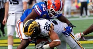 Florida Gators defensive lineman Keivonnis Davis tackles Michigan running back Drake Johnson during the 2016 Buffalo Wild Wings Citrus Bowl- Florida Gators football- 1280x855