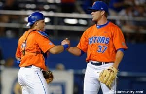 University of Florida Cather Mike Rivera congratulates Shaun Anderson following the Florida Gators 6-0 win over Florida State- Florida Gators baseball- 1280x852