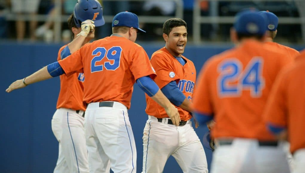 University of Florida freshman outfielder Nelson Maldonado is greeted by teammates after his home run against FSU- Florida Gators baseball-1280x852