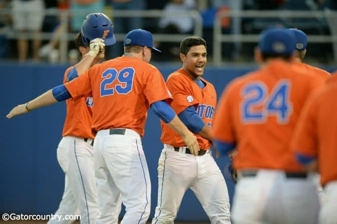 University of Florida freshman outfielder Nelson Maldonado is greeted by teammates after his home run against FSU- Florida Gators baseball-1280x852