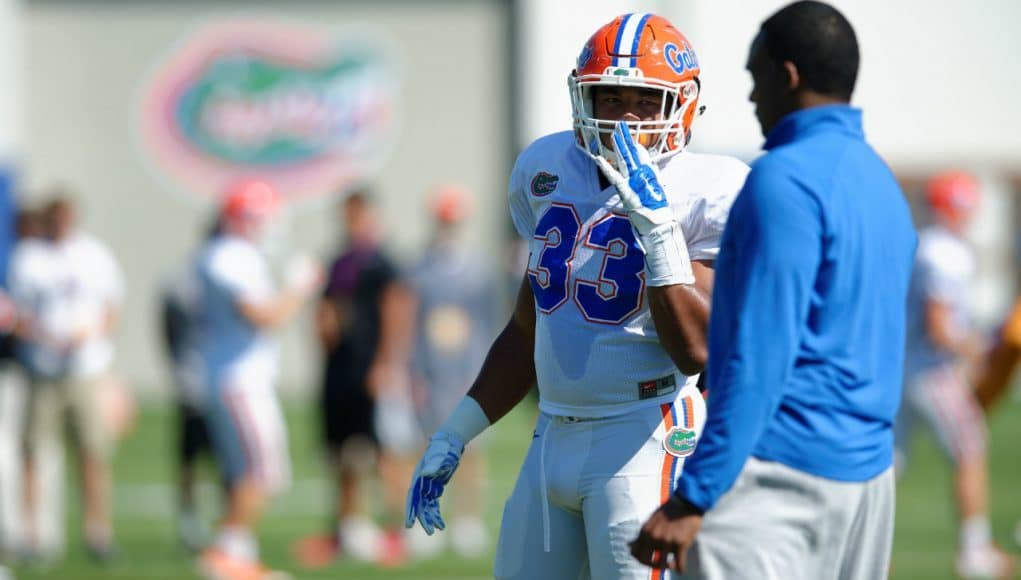 University of Florida linebackers coach Randy Shannon and freshman linebacker David Reese during the Florida Gators 2016 spring football camp- Florida Gators football- 1280x852