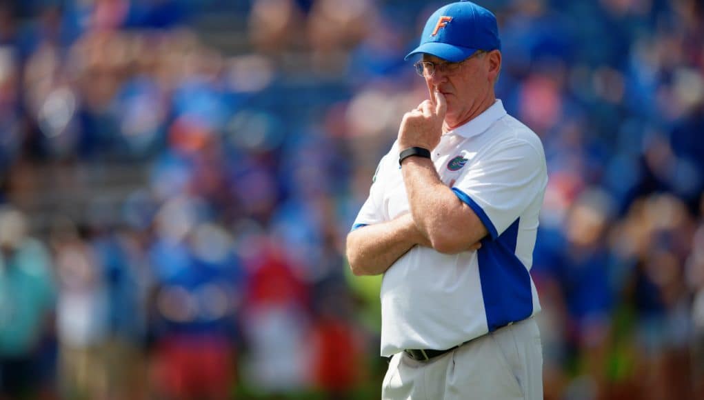 University of Florida offensive line coach Mike Summers watches his group warm up before playing Tennessee in 2015- Florida Gators football- 1280x852