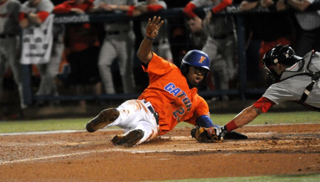 Buddy Reed slides around the tag and successfully steals home against Georgia on Friday, April 22 - Photo courtesy of Jordan McPherson / The Independent Florida Alligator