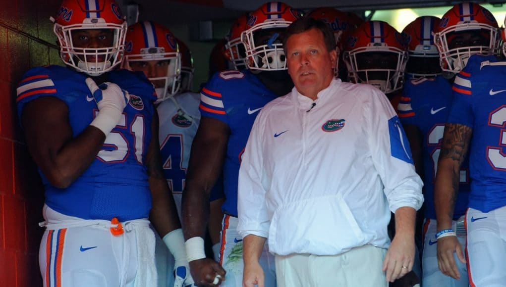 Florida Gators head coach Jim McElwain leads the team out for the spring game- 1280x853