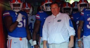 Florida Gators head coach Jim McElwain leads the team out for the spring game- 1280x853