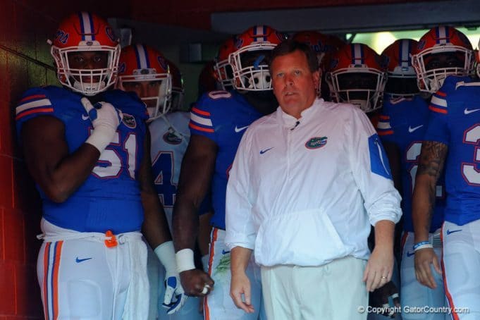 Florida Gators head coach Jim McElwain leads the team out for the spring game- 1280x853