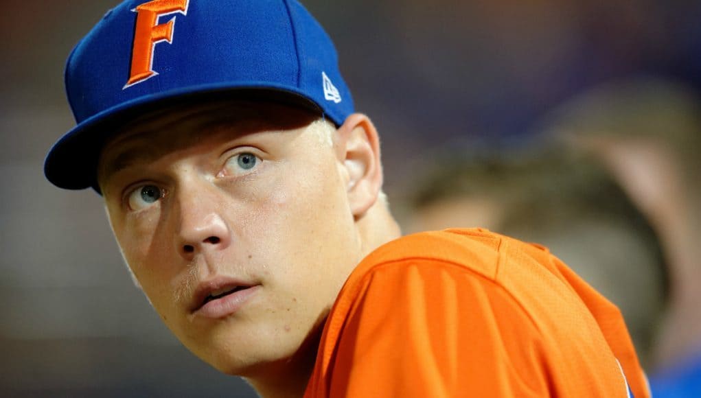 University of Florida catcher JJ Schwarz stands in the dugout in a home win against Florida State on Tuesday, March 15 2016- Florida Gators baseball- 1280x852