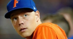 University of Florida catcher JJ Schwarz stands in the dugout in a home win against Florida State on Tuesday, March 15 2016- Florida Gators baseball- 1280x852