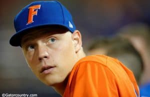 University of Florida catcher JJ Schwarz stands in the dugout in a home win against Florida State on Tuesday, March 15 2016- Florida Gators baseball- 1280x852