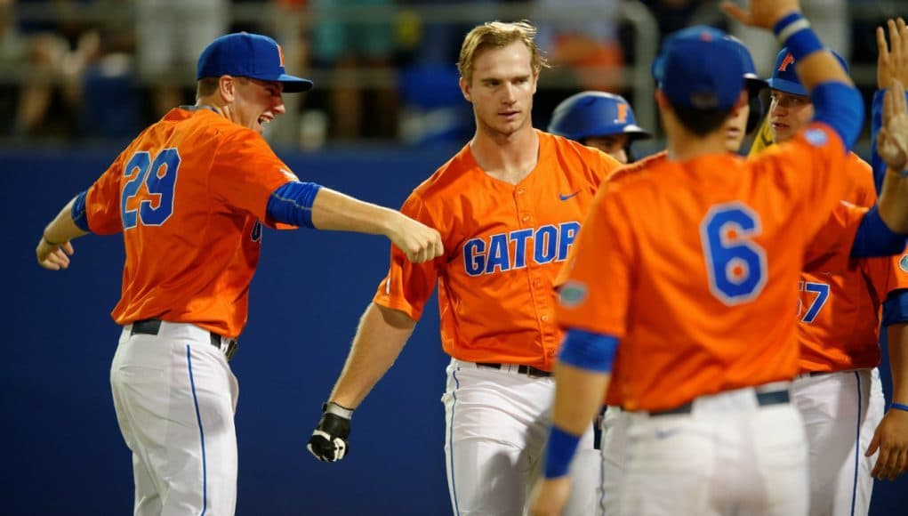 University of Florida junior first baseman Pete Alonso celebrates with teammates following his home run against Florida State- Florida Gators baseball- 1280x852