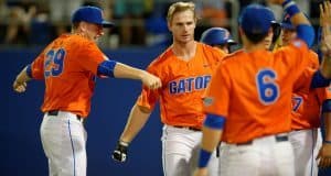 University of Florida junior first baseman Pete Alonso celebrates with teammates following his home run against Florida State- Florida Gators baseball- 1280x852