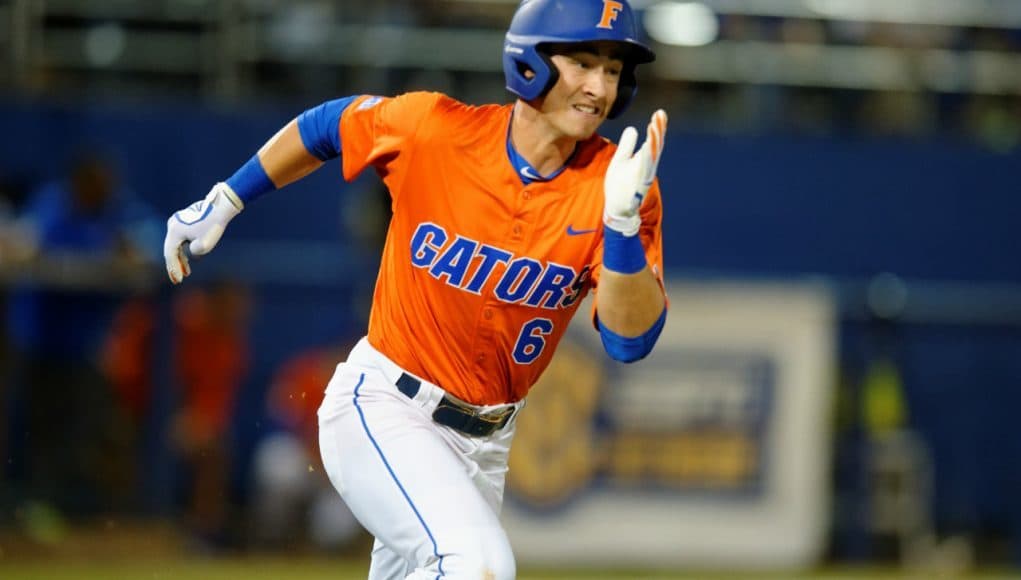 University of Florida third baseman Jonathan India runs to first base for a single against Florida State- Florida Gators baseball- 1280x852