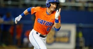 University of Florida third baseman Jonathan India runs to first base for a single against Florida State- Florida Gators baseball- 1280x852