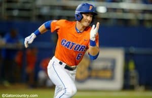 University of Florida third baseman Jonathan India runs to first base for a single against Florida State- Florida Gators baseball- 1280x852