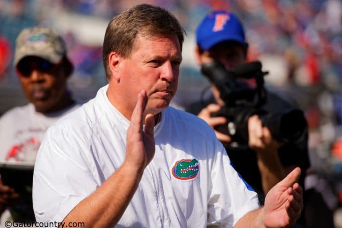 University of Florida head coach Jim McElwain leads his team through warmups before the Florida Gators game against the Georgia Bulldogs in 2015- Florida Gators football- 1280x852