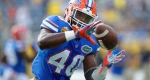 University of Florida linebacker Jarrad Davis catches a pass during warmups before the Buffalo Wild Wings Citrus Bowl vs. Michigan in 2016- Florida Gators football- 1280x852