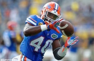 University of Florida linebacker Jarrad Davis catches a pass during warmups before the Buffalo Wild Wings Citrus Bowl vs. Michigan in 2016- Florida Gators football- 1280x852