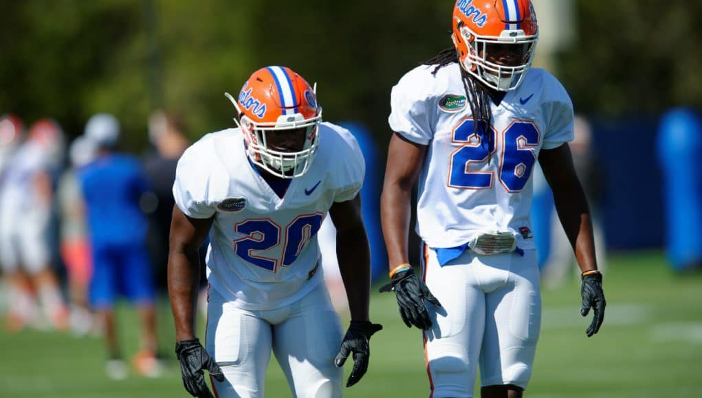 University of Florida safeties Marcus Maye (20) and Marcell Harris (26) go through drills during spring football camp- Florida Gators football- 1280x852