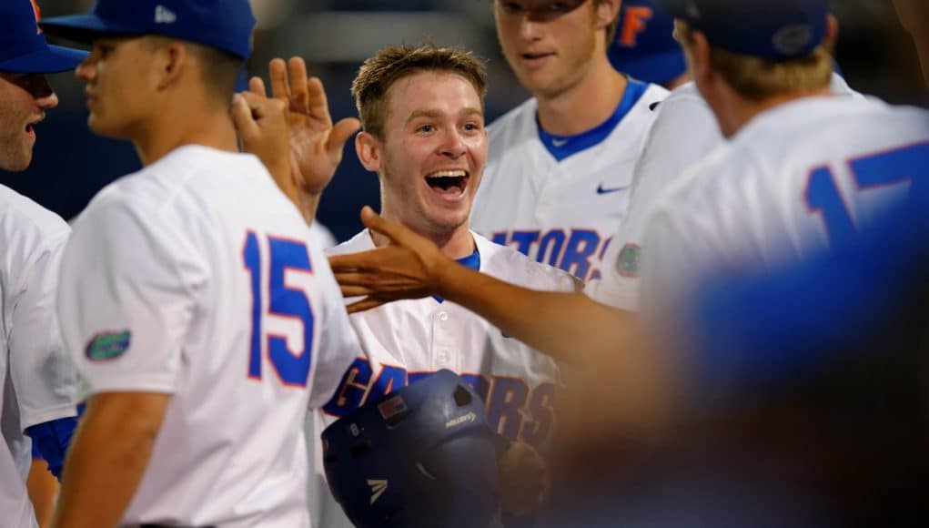 University of Florida second baseman Deacon Liput celebrates with teammates after scoring against Vanderbilt- Florida Gators baseball- 1280x852