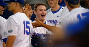 University of Florida second baseman Deacon Liput celebrates with teammates after scoring against Vanderbilt- Florida Gators baseball- 1280x852