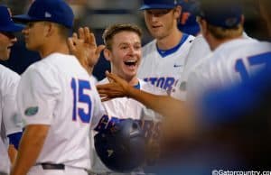 University of Florida second baseman Deacon Liput celebrates with teammates after scoring against Vanderbilt- Florida Gators baseball- 1280x852