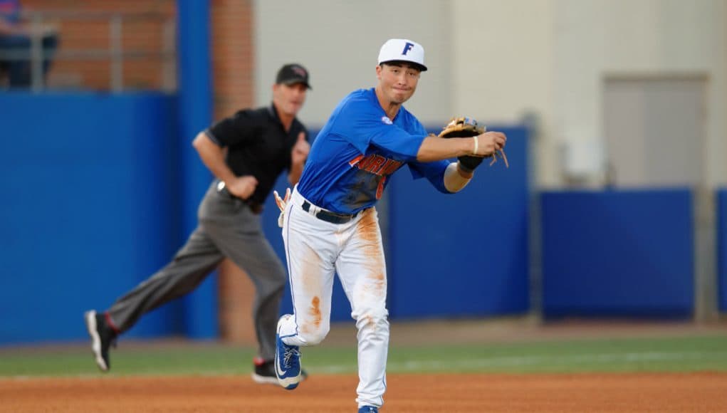 University of Florida third baseman Jonathan India fields and throws a ball to first against Florida Gulf Coast- Florida Gators baseball- 1280x852