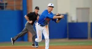 University of Florida third baseman Jonathan India fields and throws a ball to first against Florida Gulf Coast- Florida Gators baseball- 1280x852