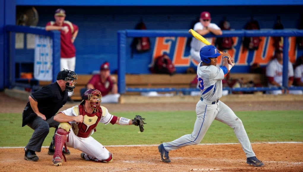 University of Florida outfielder Buddy Reed swings at a pitch during a 2015 Super Regional matchup against Florida State- Florida Gators baseball- 1280x852