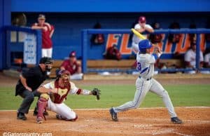 University of Florida outfielder Buddy Reed swings at a pitch during a 2015 Super Regional matchup against Florida State- Florida Gators baseball- 1280x852