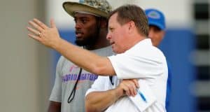 University of Florida head coach Jim McElwain and senior linebacker Jarrad Davis talk during McElwain’s youth football camp- Florida Gators football- 1280x852