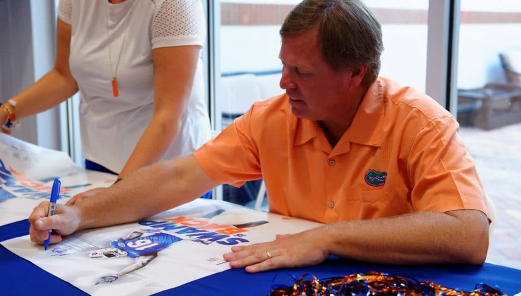 Florida Gators head coach Jim McElwain signs autographs at fan day- 1280x853
