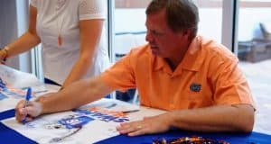 Florida Gators head coach Jim McElwain signs autographs at fan day- 1280x853