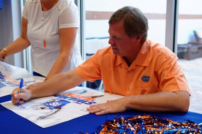 Florida Gators head coach Jim McElwain signs autographs at fan day- 1280x853