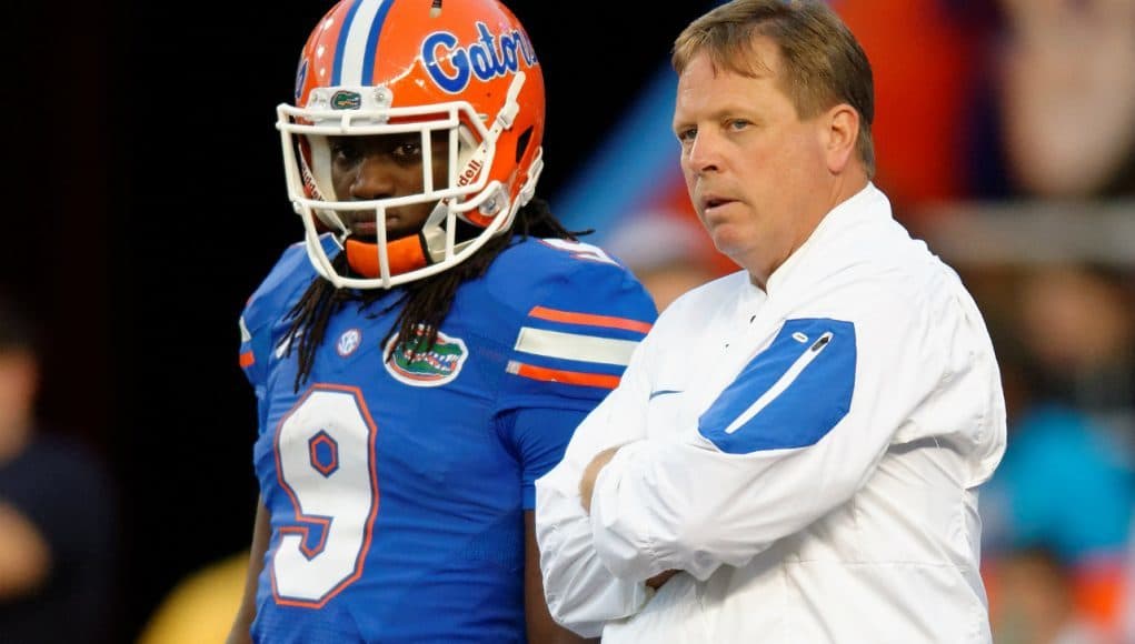 University of Florida head coach Jim McElwain and Dre Massey talk on the field during the Orange and Blue game- Florida Gators football- 1280x852