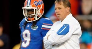 University of Florida head coach Jim McElwain and Dre Massey talk on the field during the Orange and Blue game- Florida Gators football- 1280x852