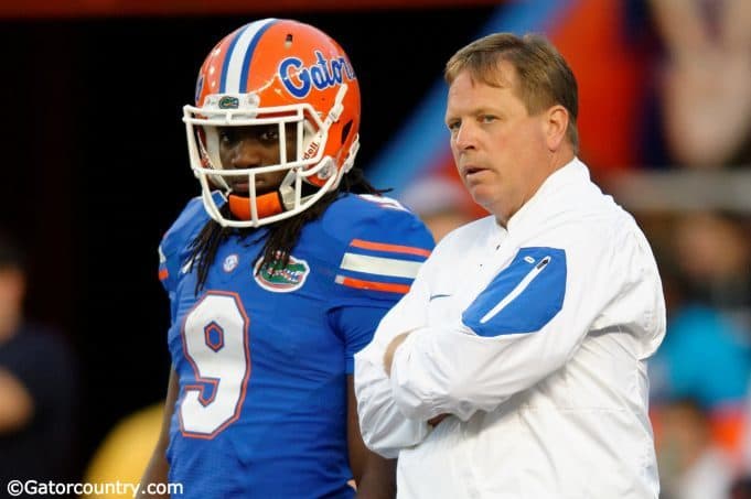 University of Florida head coach Jim McElwain and Dre Massey talk on the field during the Orange and Blue game- Florida Gators football- 1280x852